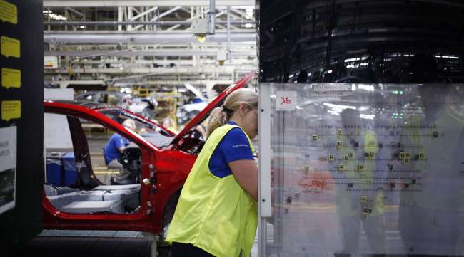 An employee works inside a Toyota manufacturing plant in Georgetown, Ky., in August 2019.