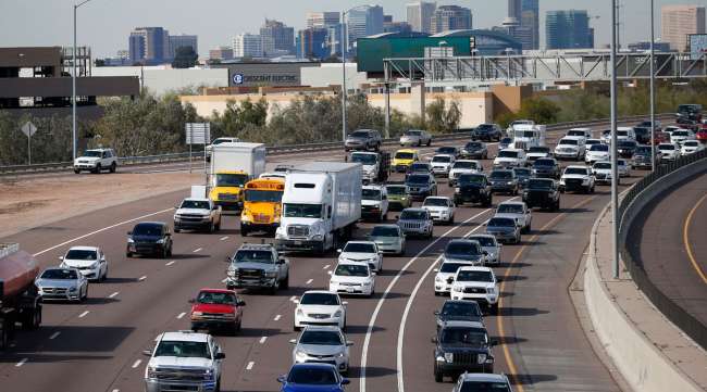 Early rush hour traffic rolls along I-10 in Phoenix on Jan. 24.