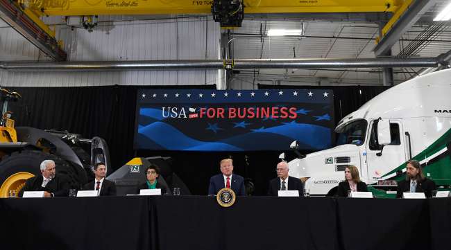 President Donald Trump visiting a truck dealership in Burnsville, Minn.