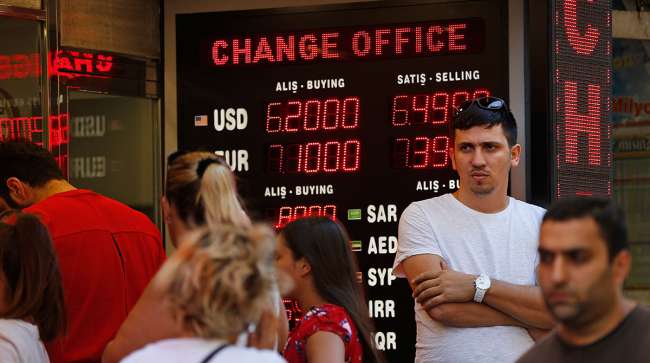 People line up at a currency exchange shop in Istanbul