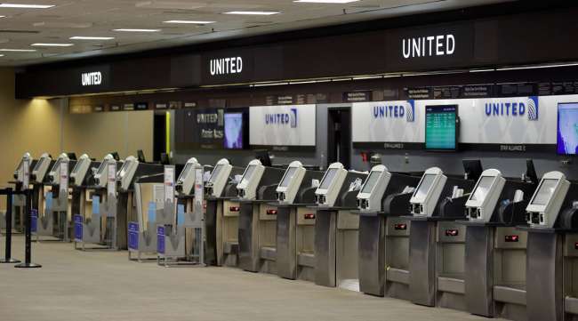 Empty United Airlines ticket machines are shown at the Tampa International Airport on April 24.
