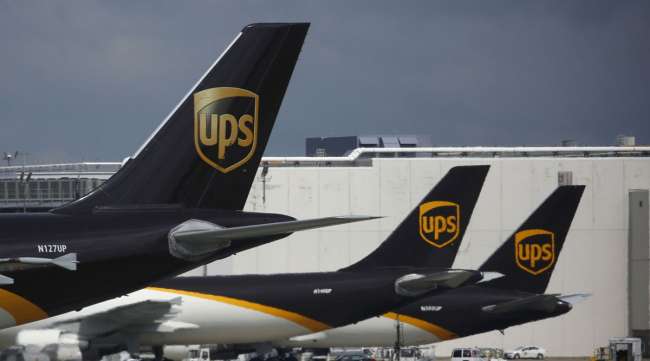 Cargo jets sit parked at the UPS Worldport in Louisville, Ky., on July 30.