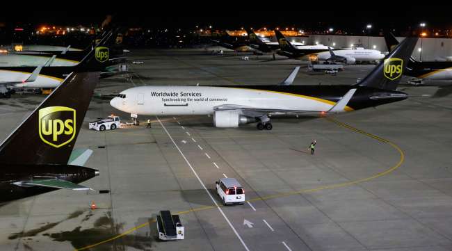 A UPS cargo plane is pushed from its gate after being loaded at the company's Worldport hub in Louisville, Ky., in November 2015.