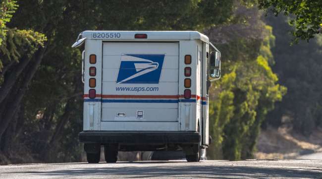 A USPS truck drives in Crockett, Calif., on Aug. 17.