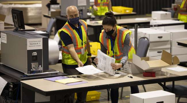Officials count votes at a convention center in Philadelphia on Nov. 4.