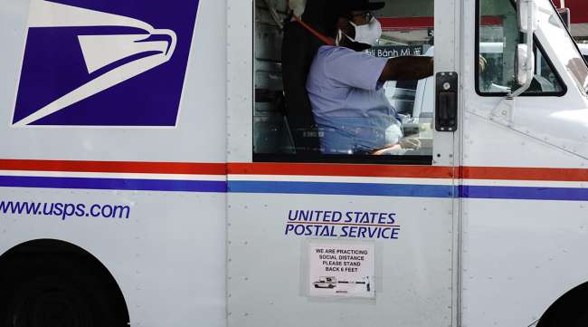 A USPS mail truck (Bing Guan/Bloomberg News)
