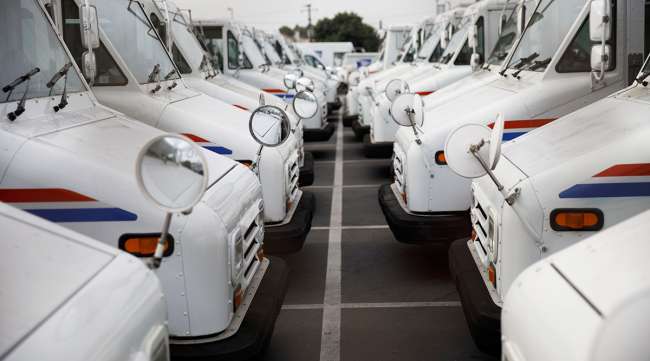 USPS delivery vehicles outside a post office in Torrance, Calif. (Patrick T. Fallon/Bloomberg News)