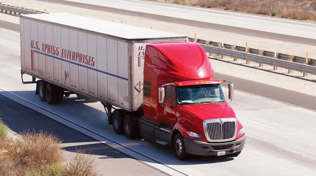 A U.S. Xpress Enterprises truck on a highway