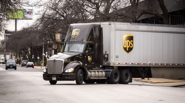 A UPS truck exits a distribution center in Chicago in November 2020. (Christopher Dilts/Bloomberg News)
