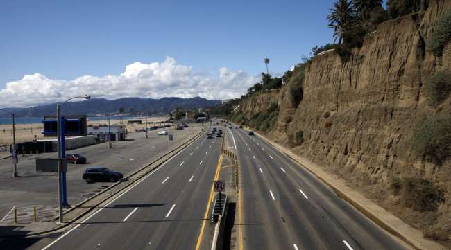 Vehicles drive in light traffic along Pacific Coast Highway in Santa Monica, Calif., on March 19.