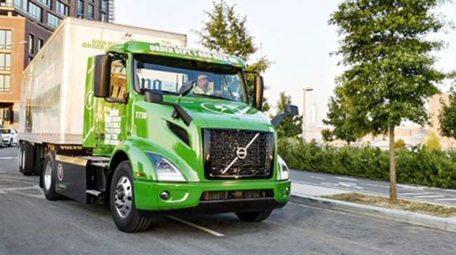 Volvo VNR Electric model making a delivery
