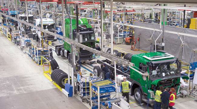Trucks roll on assembly line at a Volvo plant in Sweden