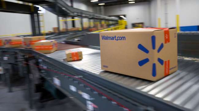 Packages move along a conveyor belt inside a Walmart fulfillment center in Pennsylvania.