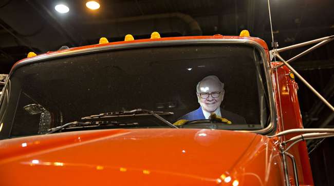 A cardboard cutout in the likeness of Warren Buffett, chairman and CEO of Berkshire Hathaway Inc., sits in the driver's seat of a truck on display during the Berkshire Hathaway annual meeting in Omaha, Neb.