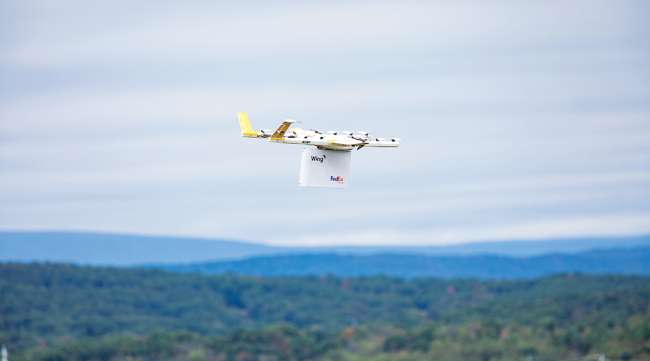 Drone carrying a FedEx package