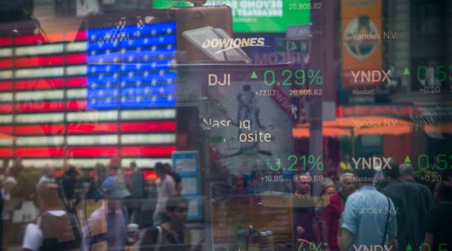 Monitors display stock market information in a window at the Nasdaq MarketSite in New York. (Michael Nagle/Bloomberg News)