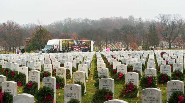 Wreaths adorn headstones at the 28th annual Wreaths Across America event at Arlington National Cemetery