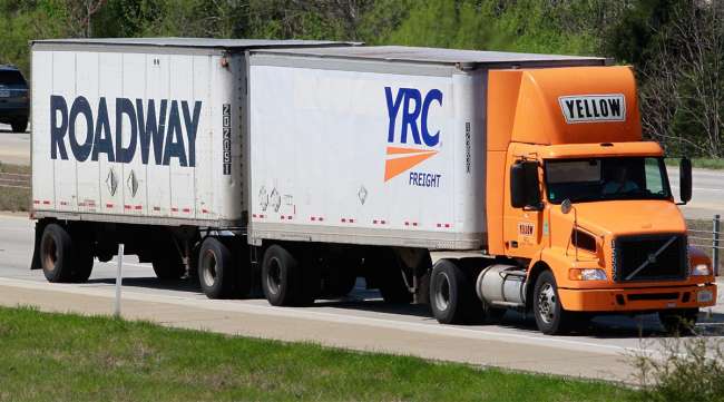 In 2018 a Yellow truck pulls YRC and Roadway trailers