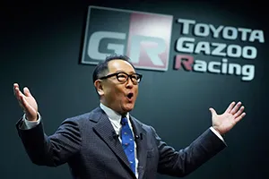 Toyoda delivers a speech on stage