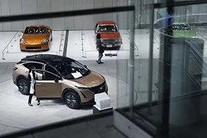 A Nissan Ariya electric crossover SUV in a showroom