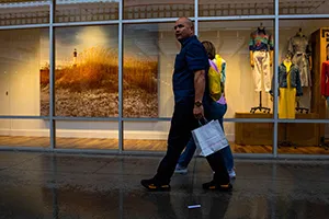 Shoppers pass a window display in Las Vegas