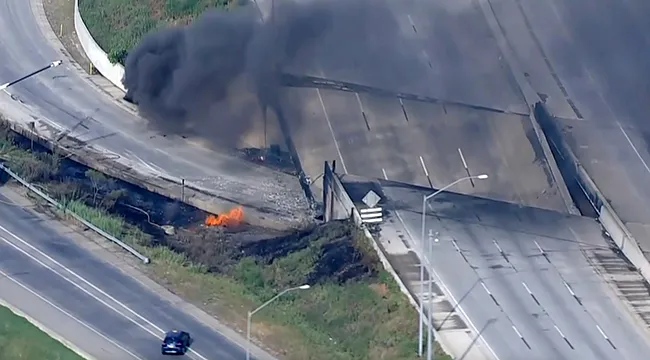 Fire and smoke near the collapsed section of I-95