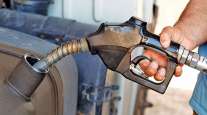 Pump dispensing fuel into a vehicle