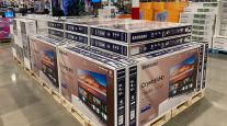 Big-screen televisions are stored in a Costco warehouse