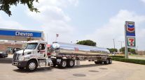 A Mission Petroleum tanker makes a delivery to a Chevron station
