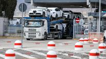 A vehicle transporter leaves a Stellantis NV factory