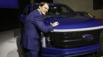 Ford CEO Jim Farley with an F-150 Lightning electric pickup.