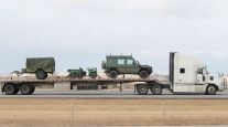 Truck transporting military vehicles