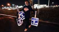 "On Strike" signs taken away from a Ford picket line