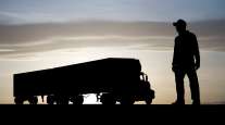 truck and driver in silhouette