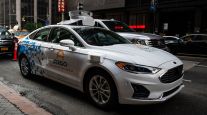 An Argo-modified Ford Fusion autonomous vehicle sits parked in New York in July 2019.