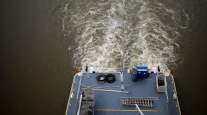 A towboat pushes barges up the Mississippi River