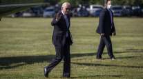 President Joe Biden walks on the Ellipse after exiting Marine One near the White House May 17