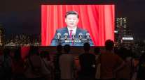  A screen shows Chinese President Xi Jinping speaking
