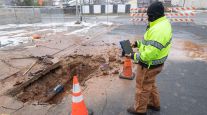 Worker surveys mended water pipe in Austin, Texas