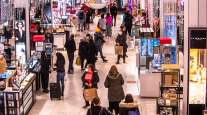 Shoppers walk through a New York City Macy's in November 2021. 