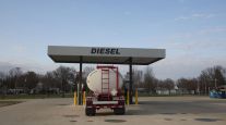 A tanker truck sits parked at a diesel fuel pump in Princeton, Ill., in April 2020.