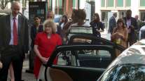 DOE's David Turk and FHWA's Stephanie :Pollack at EV event outside DOT headquarters