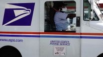A USPS mail truck (Bing Guan/Bloomberg News)