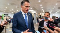 Sen. Mitt Romney speaks to reporters