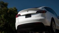 A Tesla vehicle sits on a car hauler in Fremont, Calif., in September 2020. (David Paul Morris/Bloomberg News)