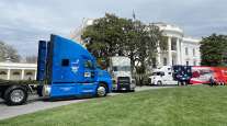 Three trucking industry truck are parked on the south side of the White House April 4, 2022