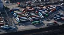 Trucks enter and exit the Port of Los Angeles