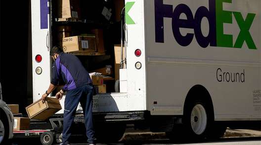 A FedEx truck is unloaded in Dallas