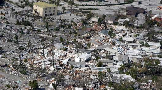 Damaged homes and debris seen in aerial shot of Fort Myers