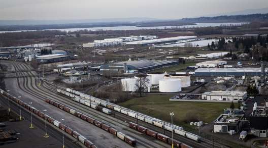 Freight trains pass in front of the United Grain Corp. terminal at the Port of Vancouver 